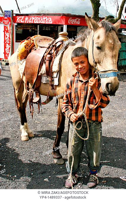 Young boy with a horse at Volcano Pacaya, Guatemala