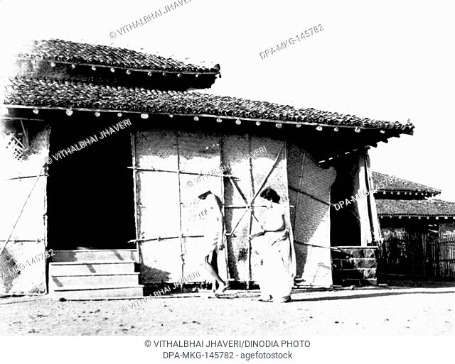 Mahatma Gandhi and Sushila Nayar entering the office hut at Sevagram Ashram , 1945 NO MR