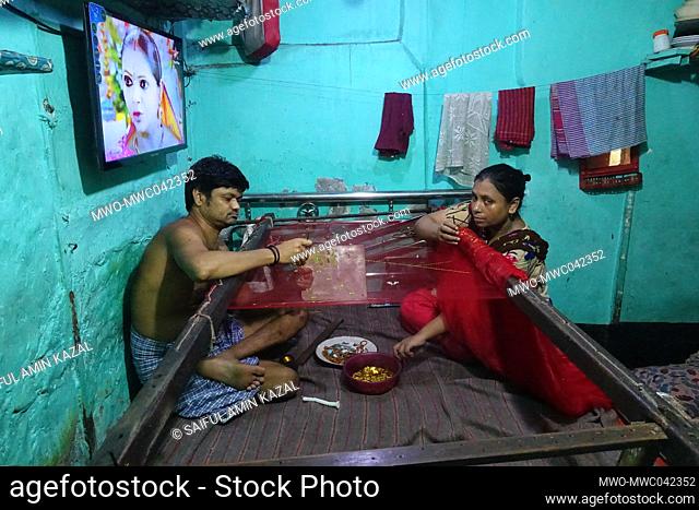Life as a Bihari. A couple working karchupi in sharee. ‘Biharis’ refers to the approximately 300, 000 non-Bengali citizens of the former East Pakistan who...