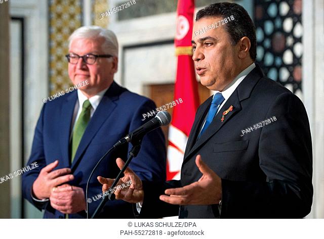 Tunisia's Prime Minister Mehdi Jomaa (R) speaks after being awarded the German Federal Cross of Merit by German Foreign Minister Frank-Walter Steinmeier (SPD