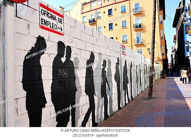Graffiti depicting a line of unemployed, Saint Paul's Quarter, Zaragoza, Spain