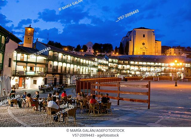 People sitting on terraces at nightfall. Main Square, Chinchon, Madrid province, Spain
