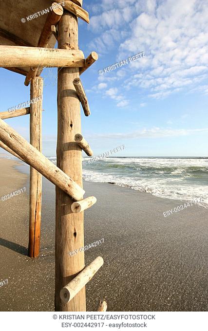 Details of the wooden stairs of a watchtower at the beach