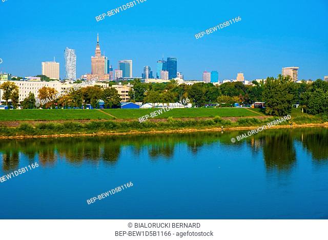 Warsaw, Mazovia / Poland - 2018/08/30: Panoramic view of the Warsaw city center skyscrapers and Solec district across the Vistula river