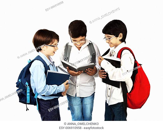 Happy schoolboys reading, back to school, holding books and talking, isolated on white background, teenage education concept