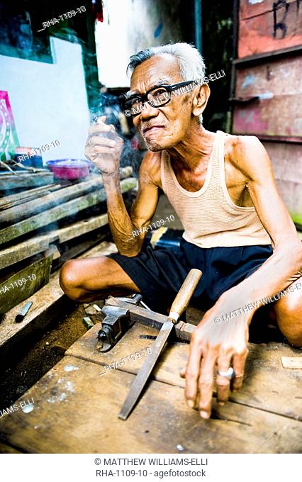 Portrait of an Indonesian carpenter man at Taman Sari, Water Castle, Yogyakarta, Central Java, Indonesia, Southeast Asia, Asia