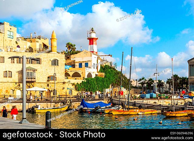Old Yaffo. Twilight before evening. Sunset. Yachts on an anchor in Yaffo port. Old Jaffo - one of the most ancient cities of the world
