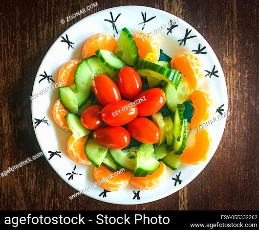 healhy plate with mandarin cucumber and tomatoes amsterdam