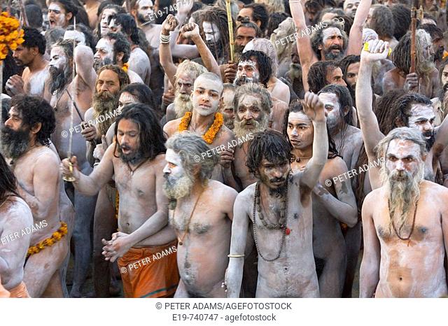 Naga Sadhus returning from bathing in The holy river Ganges at Kumbh Mela Festival. Allahabad, Uttar Pradesh, India
