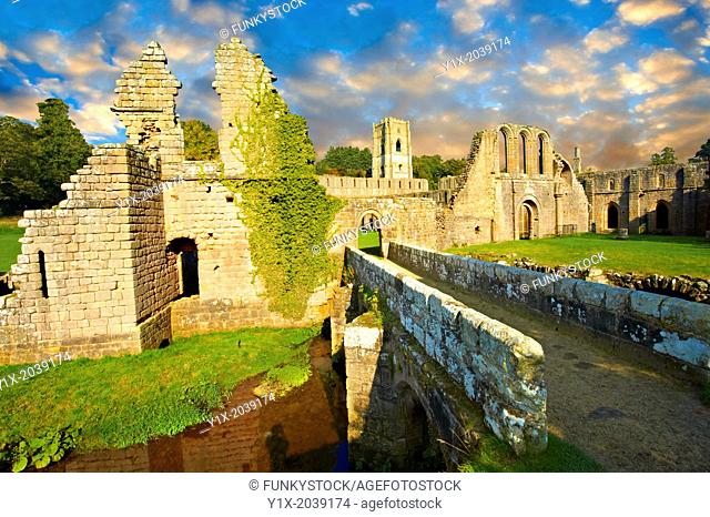 Entrance at sunrise of the ruins of Fountains Abbey , founded in 1132, is one of the largest and best preserved ruined Cistercian monasteries in England
