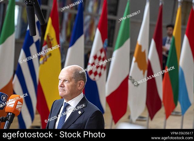 Chancellor of Germany Olaf Scholz talks to the press ahead of a special meeting of the European council, at the European Union headquarters in Brussels