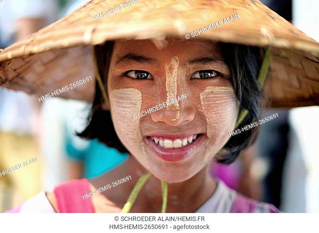 Myanmar, Mandalay Province, Mandalay, girl with thanaka on her face