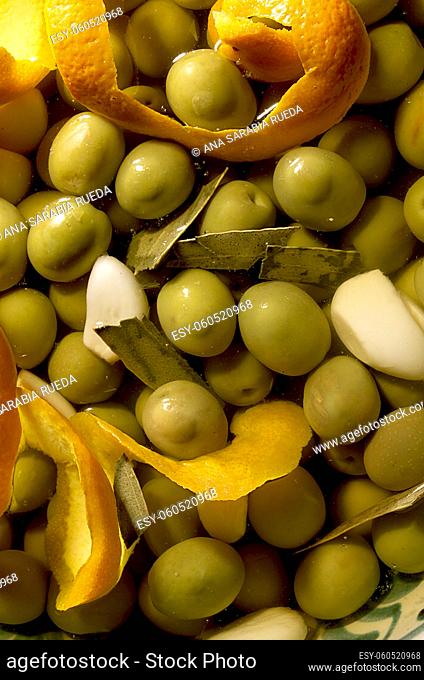 Close-up of Spanish green olives, seasoned with garlic and sour orange