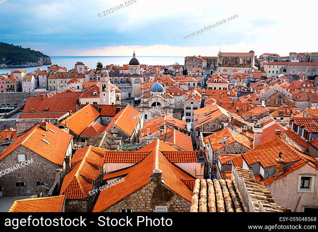 View over the roofs of old town Dubrovnik with church towers and ocean in winter, Croatia