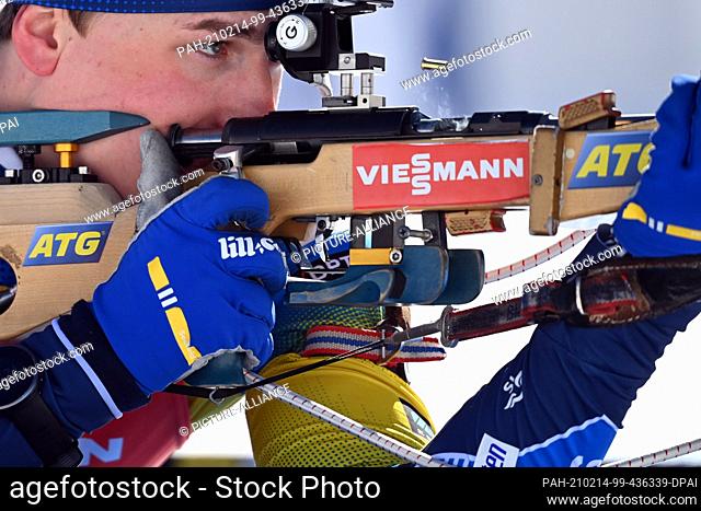 14 February 2021, Slovenia, Pokljuka: Biathlon: World Championship, Pursuit 12.5 km, men. Martin Ponsiluoma from Sweden shooting at the start