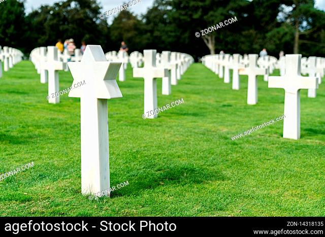 Omaha Beach, Normandy / France - 16 August 2019: view of Christian and Jewish headstones in the American Cemetery at Omaha Beach in Normandy