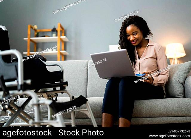 African Woman Shopping Online Using Credit Card