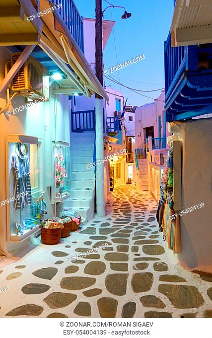 Narrow street in Mykonos town in the evening, Greece