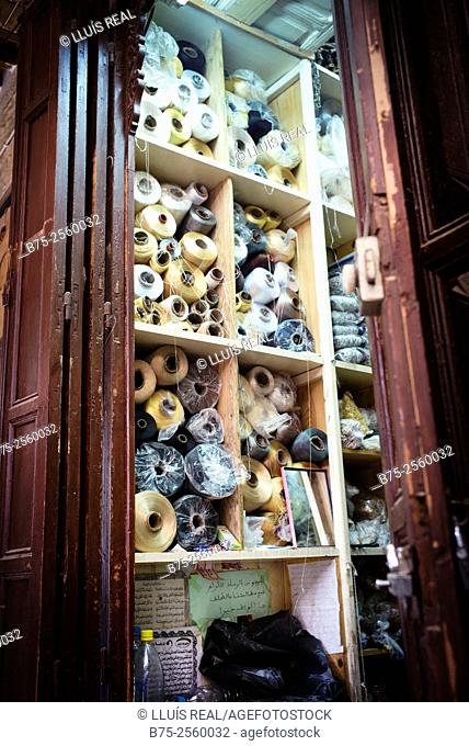 Store shelves filled with spools of thread in Fez Medina. Fes, Historic City, Heritage, Morocco, Africa