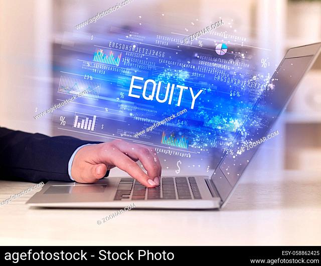 Closeup of businessman hands working on laptop with EQUITY inscription, succesfull business concept