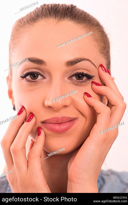 Beauty Spa Woman Portrait. Beautiful Girl Touching her Face. Perfect Fresh Skin. Pure Beauty Model Girl. Youth and Skin Care Concept. Pampering Skin