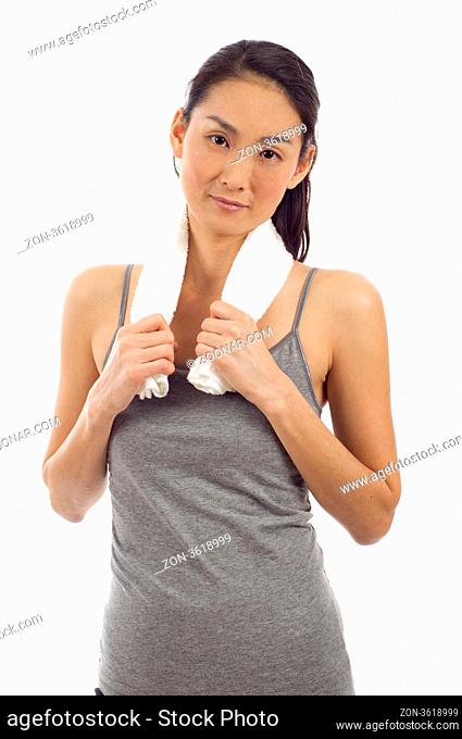 Fitness young Asian woman with towel around her neck posing isolated over white background