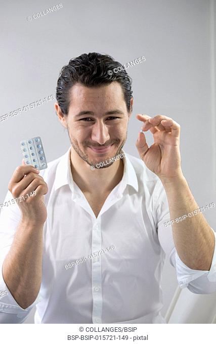 Man taking contraceptive pill