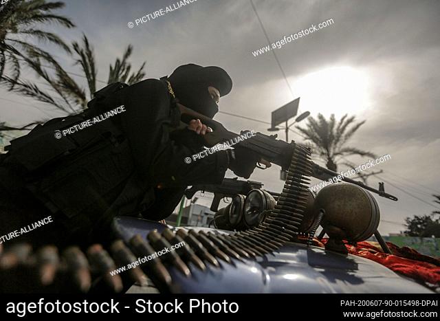07 June 2020, Palestinian Territories, Gaza City: A member of the Palestinian Islamic Jihad militant group takes part in a symbolic funeral for the movement's...