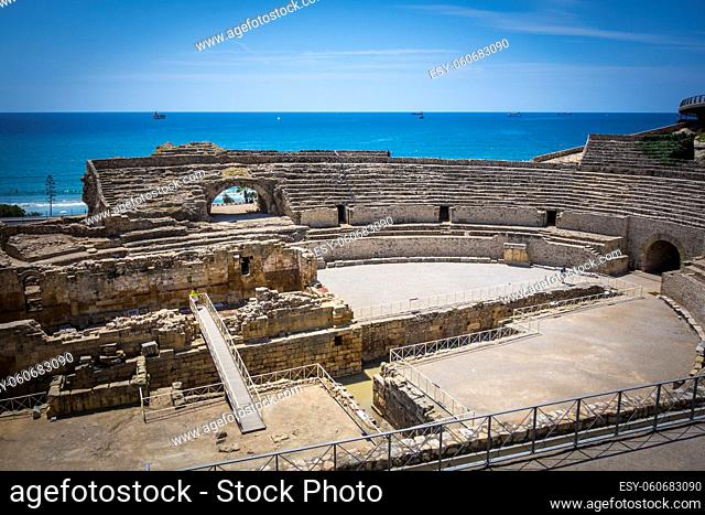 Roman amphitheater and the Mediterranean sea on the background. In Tarragona, Spain
