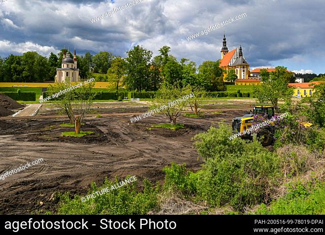 12 May 2020, Brandenburg, Neuzelle: The construction site of the extension of the monastery garden with the catholic (r) and protestant church (l) in the...