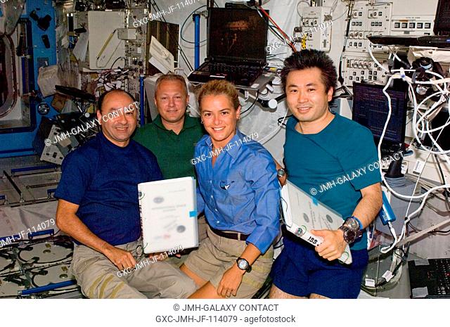 From left, astronauts Mark Polansky, STS-127 commander; and Doug Hurley, pilot; with Canadian Space Agency astronaut Julie Payette and Japanese Aerospace...