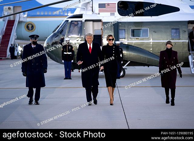 U.S. President Donald Trump, center left, and U.S. First Lady Melania Trump arrive to a farewell ceremony at Joint Base Andrews, Maryland, U.S