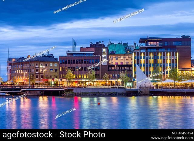Sweden, Southeast Sweden, Lake Vattern Area, Jonkoping, renovated harbor area along Munksjon Bay, dusk