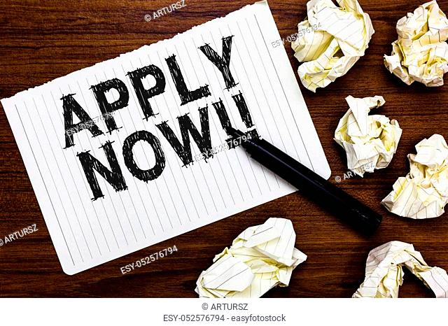 Text sign showing Apply Now. Conceptual photo Make a formal application for a job right away Take action Marker over notebook crumpled papers ripped pages...