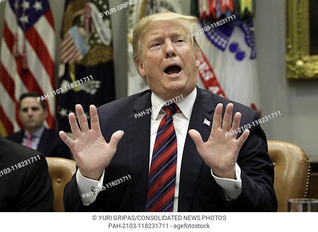 United States President Donald J. Trump gestures during a briefing on drug trafficking on the Southern Border at the White House in Washington on March 13, 2019