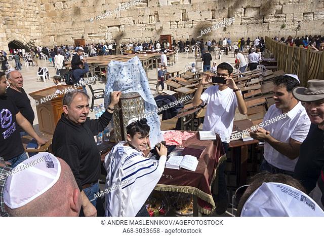 Bar Mitzvah ritual at the Western Wall, in Jerusalem. A boy who has become a Bar Mitzvah is morally and ethically responsible for his decisions and actions