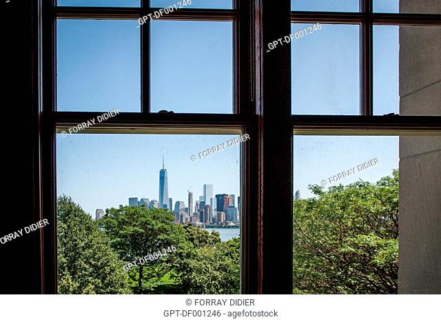 VIEW OF MANHATTAN AND ONE WORLD TRADE CENTER FROM A WINDOW IN THE MAIN BUILDING ON ELLIS ISLAND, MUSEUM OF IMMIGRATION IMMIGRATION, NEW YORK HARBOR