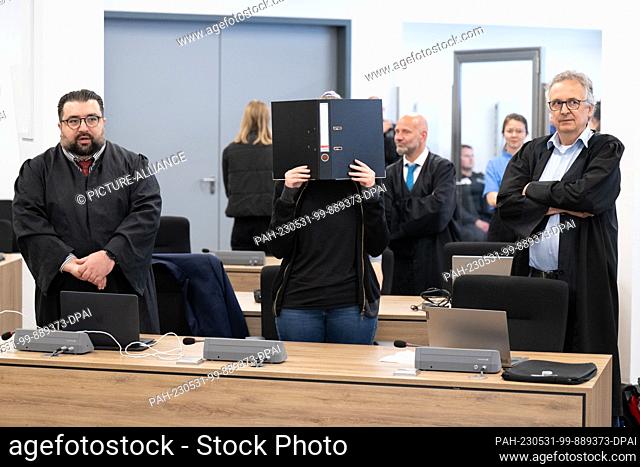 dpatop - 31 May 2023, Saxony, Dresden: The defendant (M) stands in the courtroom during the continuation of the trial at the Dresden Higher Regional Court (OLG)...