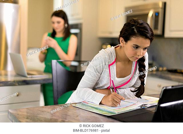 Mixed race girl doing homework