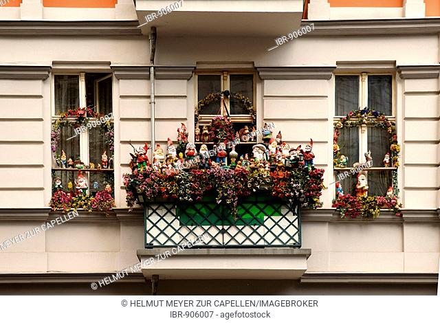 Windows and balcony of an apartment building full of garden gnomes, Prenzlauer Berg, Berlin, Germany, Europe