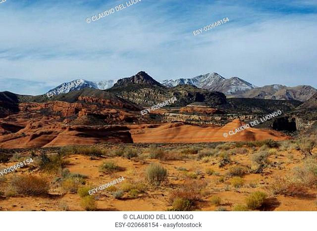 Orange sand, red rocks and Henry Mountains, Utah
