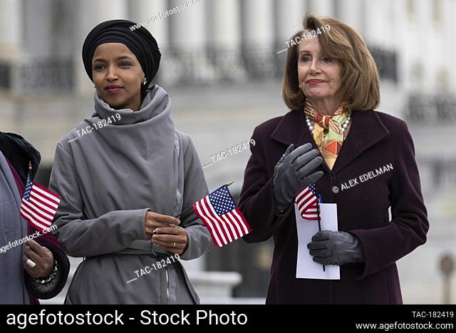 House Speaker Nancy Pelosi, a Democrat from California, looks at Rep. Ilhan Omar, Democrat from Minnesota, during a press event celebrating the passage of the...