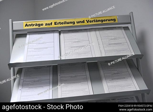 07 April 2022, Hamburg: ""Applications for issuance and extension"" is written on a display stand with applications for residence permits