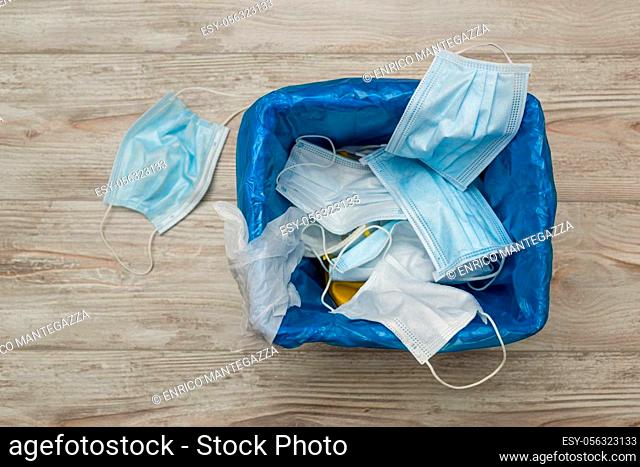 Used and contaminated surgical masks in the waste bin