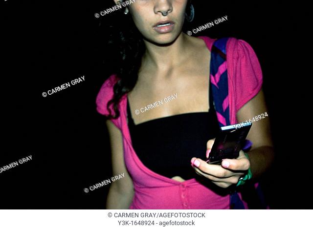 Young woman looking at cell phone