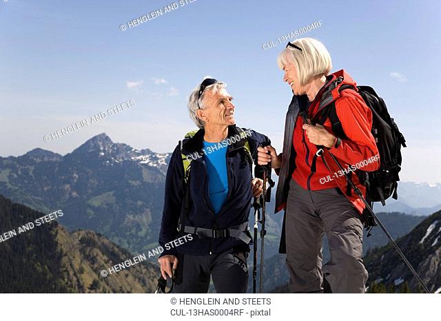 couple talking on ski tour in mountains