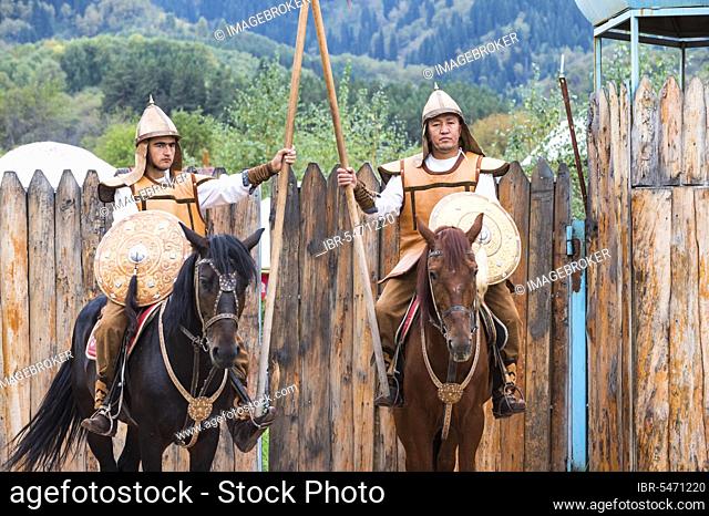 Two horsemen in front of the entrance to the Kazakh ethnographic village of Aul Gunny, Talgar city, Almaty, Kazakhstan, Central Asia, For editorial Use only