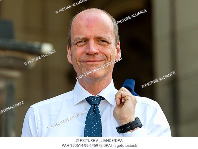 12 June 2019, Saxony, Dresden: Matthias Haß (CDU), Minister of Finance of Saxony, can be seen in the Dresden Zwinger during a tour together with the state-owned...