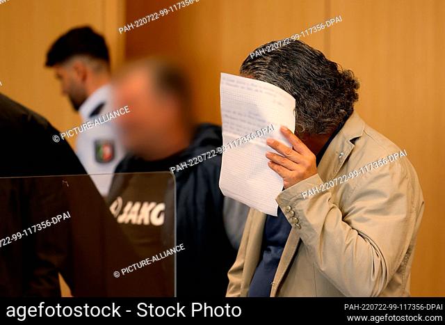22 July 2022, North Rhine-Westphalia, Duesseldorf: The two defendants in the courtroom. In the trial against the two alleged heads of a money counterfeiting...
