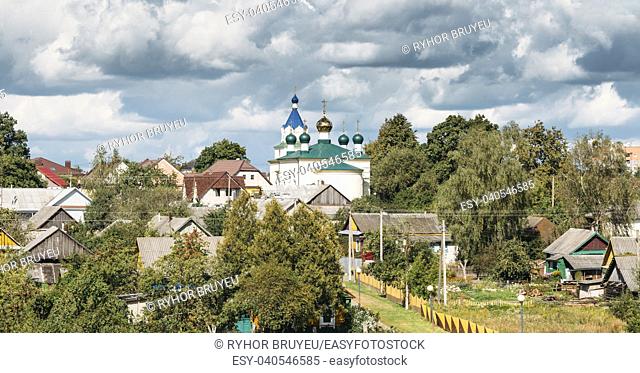 Mir, Belarus. Panoramic Landscape Of Village Houses And Orthodox Church Of The Holy Trinity In Mir, Belarus. Famous Landmark